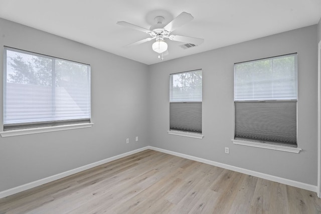 2009 Campfield Pkwy, Austin, TX 78745 - empty room with light wood-style flooring, baseboards, and a ceiling fan