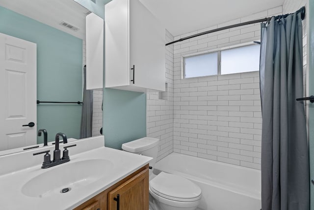 2009 Campfield Pkwy, Austin, TX 78745 - full bath with vanity, shower / bathtub combination with curtain, and toilet