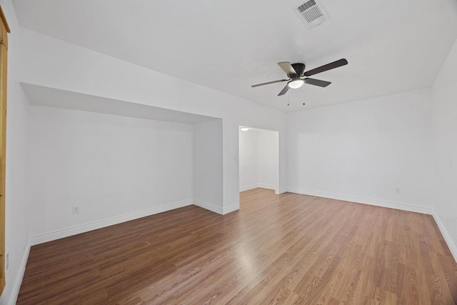 16202 Kicking Bird Dr, Leander, TX 78641 - unfurnished room with wood finished floors, a ceiling fan, and baseboards