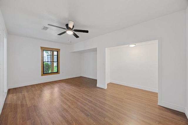 16202 Kicking Bird Dr, Leander, TX 78641 - spare room with ceiling fan, wood finished floors, and baseboards