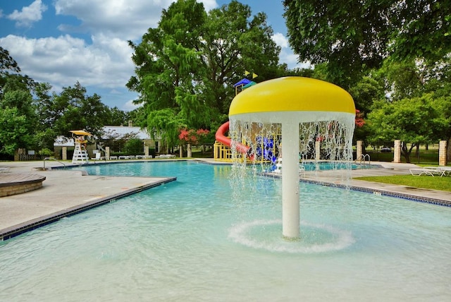 16202 Kicking Bird Dr, Leander, TX 78641 - community pool with a patio and a water slide