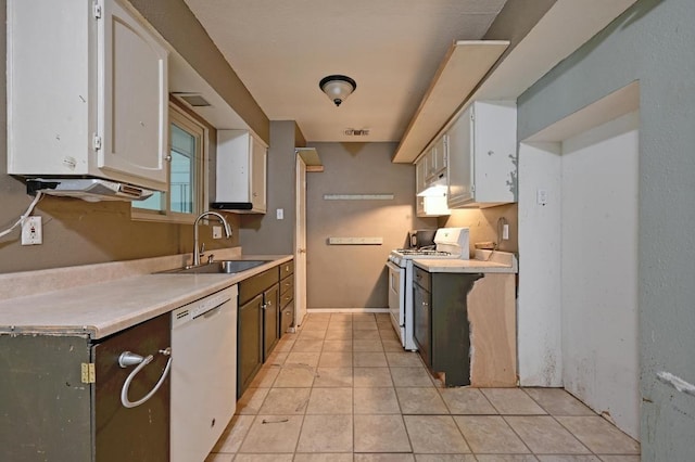 6212 Boxcar Run, Austin, TX 78745 - kitchen with white appliances, a sink, light countertops, white cabinets, and light tile patterned flooring