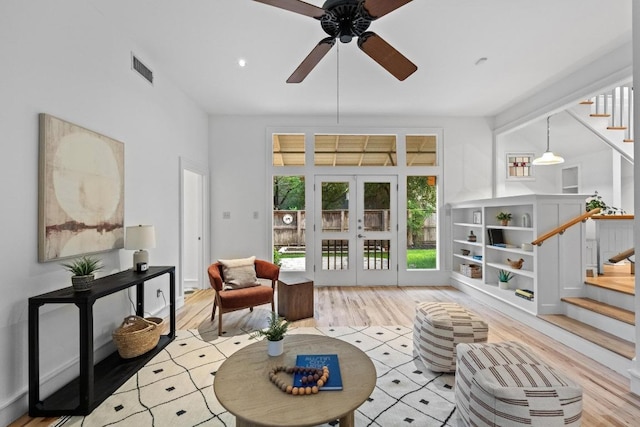 4517 Ave G, Austin, TX 78751 - living room featuring ceiling fan, wood finished floors, stairway, french doors, and recessed lighting