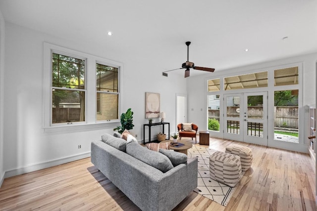 4517 Ave G, Austin, TX 78751 - living room featuring plenty of natural light, wood finished floors, a ceiling fan, french doors, and recessed lighting