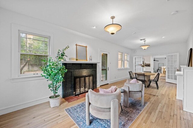 4517 Ave G, Austin, TX 78751 - living area featuring light wood-type flooring and a fireplace