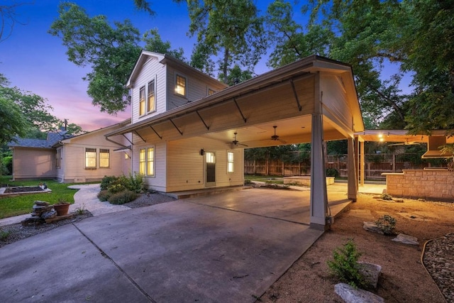 4517 Ave G, Austin, TX 78751 - view of front of home with a ceiling fan, concrete driveway, an attached carport, and a patio