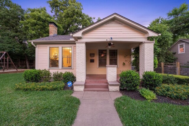 4517 Ave G, Austin, TX 78751 - view of front of home featuring ceiling fan, covered porch, and a chimney