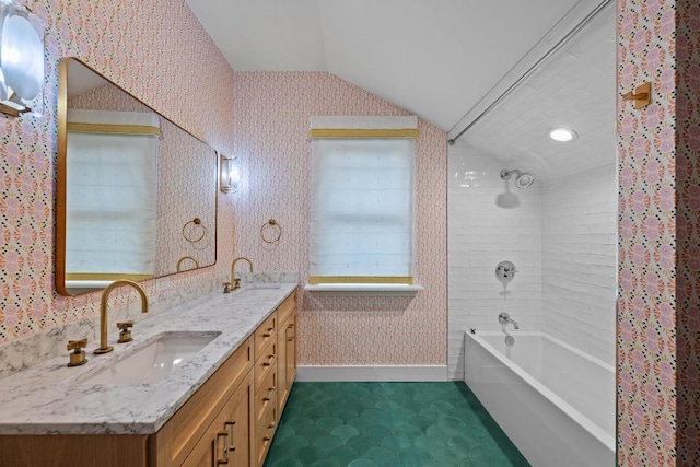 4517 Ave G, Austin, TX 78751 - full bath featuring lofted ceiling, double vanity, bathtub / shower combination, and wallpapered walls