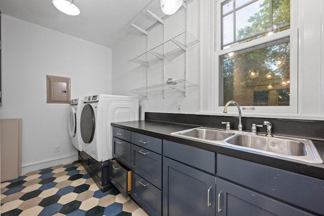 4517 Ave G, Austin, TX 78751 - laundry area with independent washer and dryer, electric panel, light floors, and cabinet space