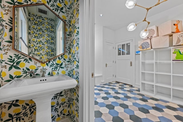 4517 Ave G, Austin, TX 78751 - bathroom featuring wallpapered walls