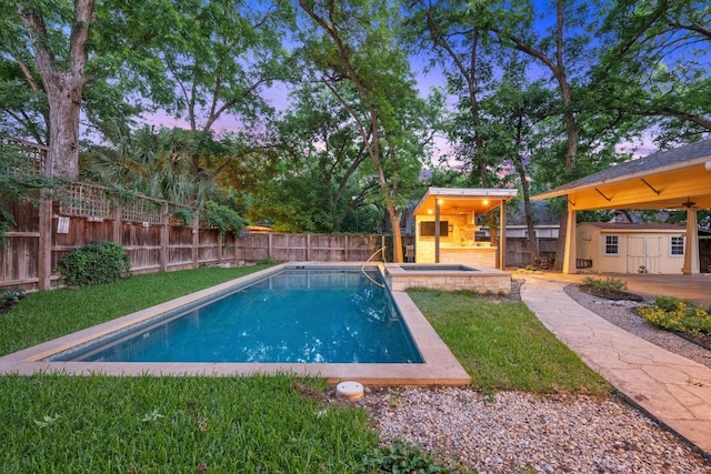 4517 Ave G, Austin, TX 78751 - view of swimming pool with an outbuilding, a fenced backyard, and a pool with connected hot tub