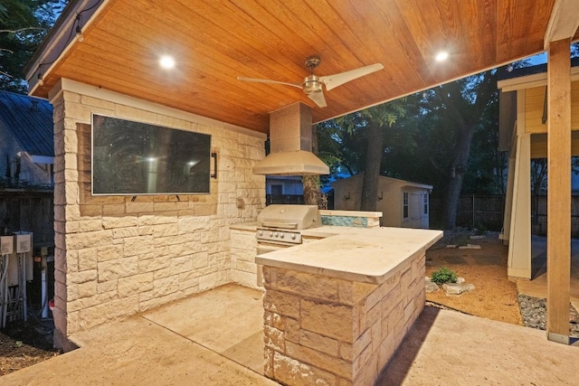 4517 Ave G, Austin, TX 78751 - view of patio featuring an outdoor kitchen, ceiling fan, and an outbuilding