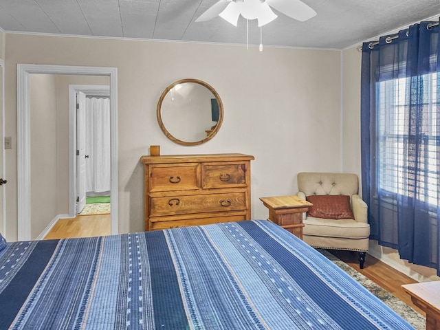 206 S Clear St, San Saba, TX 76877 - bedroom featuring light wood-style floors, crown molding, and ceiling fan