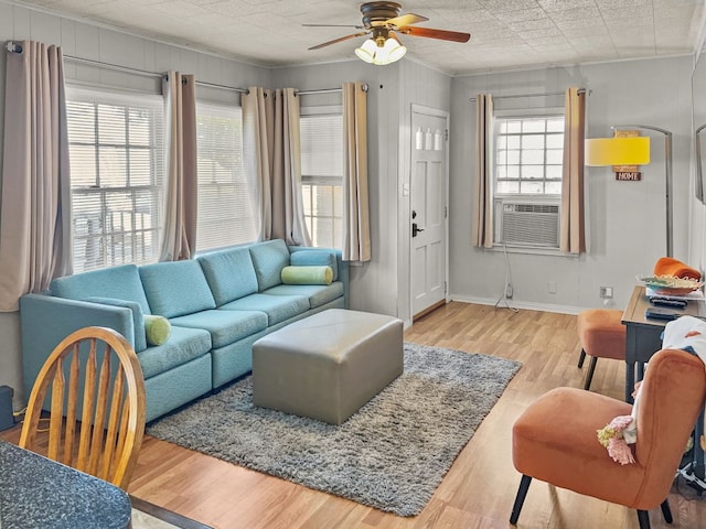 206 S Clear St, San Saba, TX 76877 - living room with ceiling fan, wood finished floors, cooling unit, and baseboards