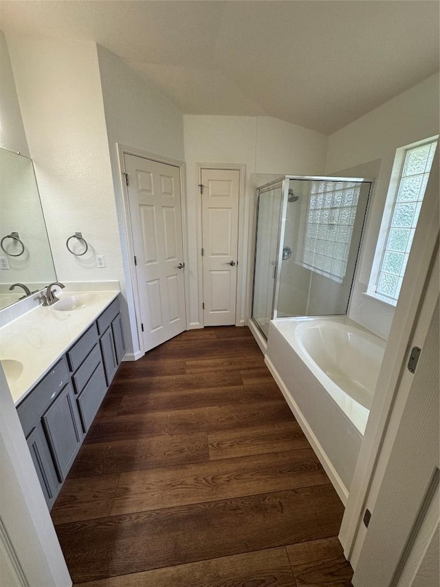 4424 Campo Verde Dr, Austin, TX 78749 - full bath featuring a bath, a shower stall, double vanity, and wood finished floors