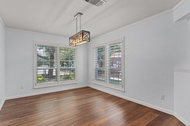 4424 Campo Verde Dr, Austin, TX 78749 - unfurnished dining area featuring a chandelier, ornamental molding, wood finished floors, and baseboards