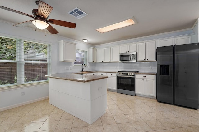 4424 Campo Verde Dr, Austin, TX 78749 - kitchen featuring stainless steel appliances, ornamental molding, a sink, white cabinets, and light tile patterned flooring