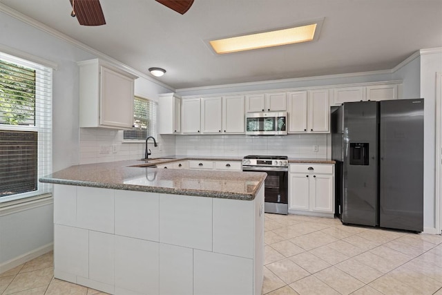4424 Campo Verde Dr, Austin, TX 78749 - kitchen featuring stainless steel appliances, a sink, crown molding, light stone counters, and white cabinetry