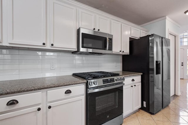 4424 Campo Verde Dr, Austin, TX 78749 - kitchen featuring stainless steel appliances, crown molding, white cabinets, backsplash, and dark stone countertops