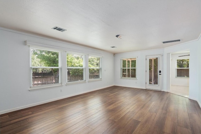 4424 Campo Verde Dr, Austin, TX 78749 - spare room with dark wood finished floors, baseboards, and ornamental molding