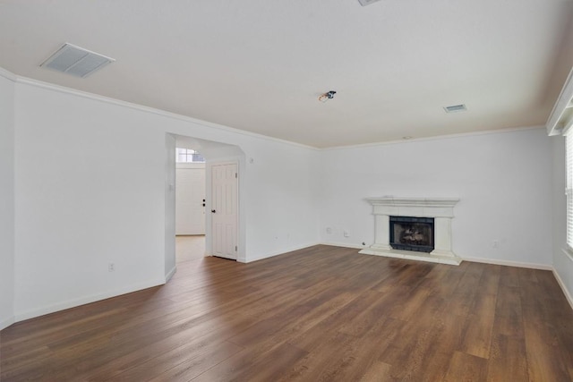 4424 Campo Verde Dr, Austin, TX 78749 - unfurnished living room featuring wood finished floors, ornamental molding, baseboards, and a fireplace with raised hearth