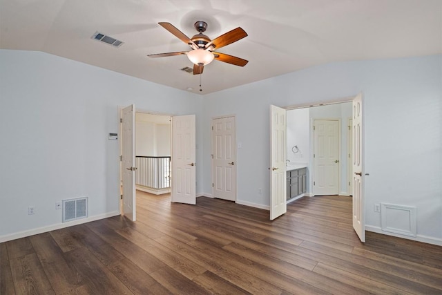 4424 Campo Verde Dr, Austin, TX 78749 - unfurnished bedroom featuring dark wood-type flooring, vaulted ceiling, and baseboards