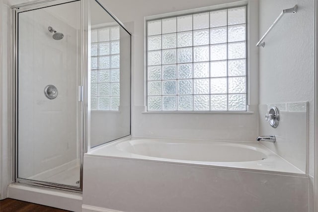 4424 Campo Verde Dr, Austin, TX 78749 - full bath with a shower stall, a garden tub, and wood finished floors