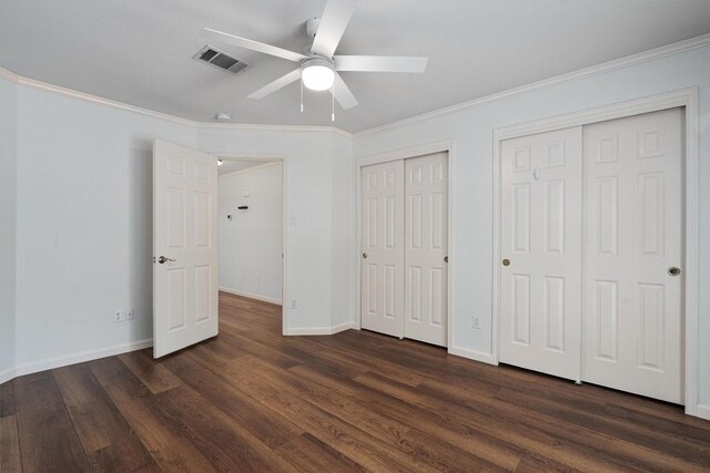 4424 Campo Verde Dr, Austin, TX 78749 - unfurnished bedroom with two closets, dark wood finished floors, crown molding, baseboards, and ceiling fan