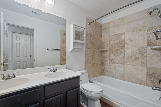 4424 Campo Verde Dr, Austin, TX 78749 - bathroom featuring bathtub / shower combination, double vanity, and toilet