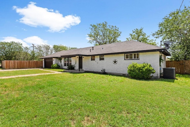 1145 E Sunset St, Waco, TX 76704 - rear view of house with central AC unit, an attached garage, crawl space, and brick siding
