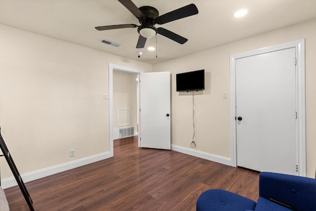 1145 E Sunset St, Waco, TX 76704 - unfurnished bedroom featuring baseboards, dark wood finished floors, a ceiling fan, and recessed lighting