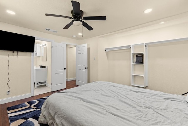 1145 E Sunset St, Waco, TX 76704 - bedroom featuring dark wood finished floors, recessed lighting, baseboards, ceiling fan, and connected bathroom