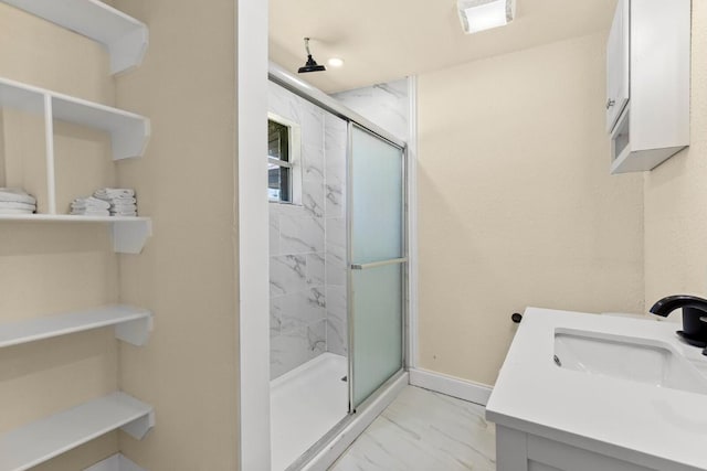 1145 E Sunset St, Waco, TX 76704 - full bathroom featuring marble look tiles, a marble finish shower, vanity, and baseboards