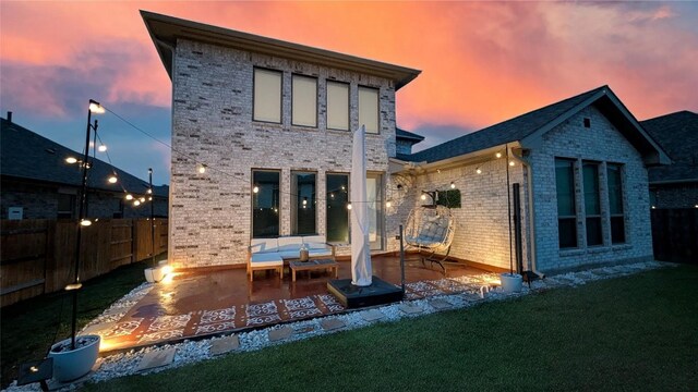 170 Fawn River Run, Kyle, TX 78640 - rear view of house featuring brick siding and a patio area