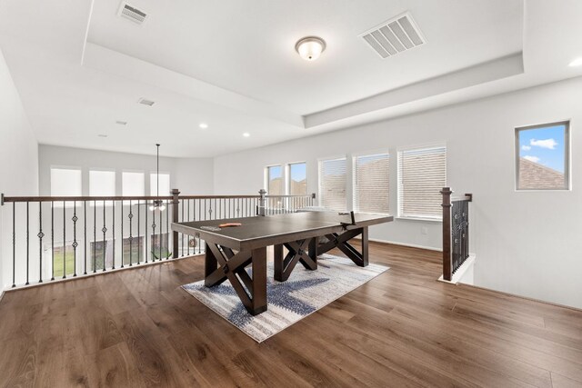 170 Fawn River Run, Kyle, TX 78640 - game room featuring a tray ceiling, wood finished floors, and recessed lighting