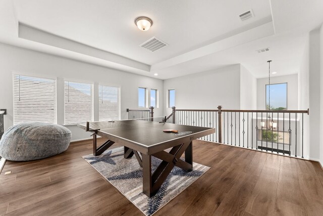 170 Fawn River Run, Kyle, TX 78640 - recreation room with a raised ceiling, wood finished floors, and recessed lighting