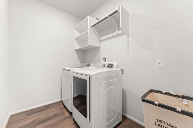 170 Fawn River Run, Kyle, TX 78640 - laundry room featuring washer and clothes dryer, wood finished floors, and baseboards