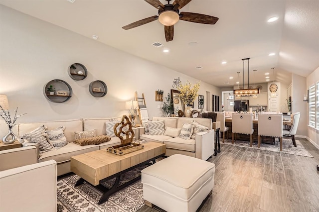 3256 Pablo Cir, Round Rock, TX 78665 - living area featuring light wood finished floors, a ceiling fan, recessed lighting, vaulted ceiling, and baseboards