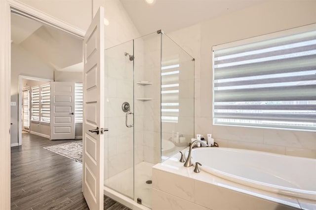 3256 Pablo Cir, Round Rock, TX 78665 - full bath featuring a garden tub, a stall shower, wood finished floors, and vaulted ceiling