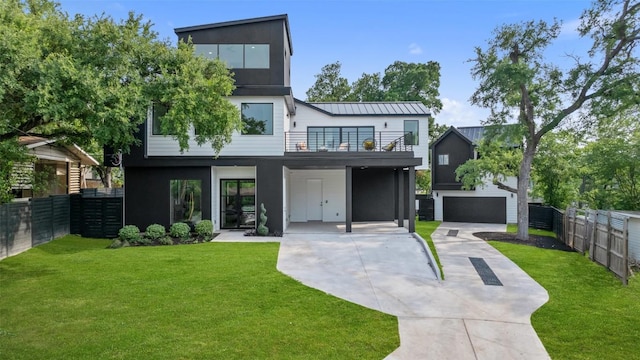 2303 Westworth Cir, Austin, TX 78704 - back of property with driveway, a balcony, and stucco siding
