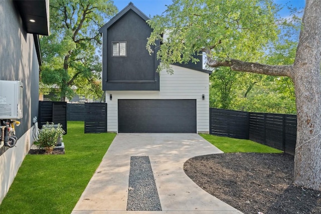 2303 Westworth Cir, Austin, TX 78704 - view of front of home featuring an attached garage and concrete driveway