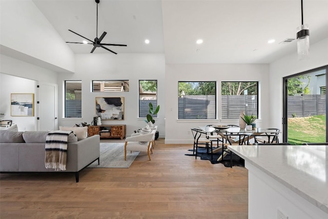 2303 Westworth Cir, Austin, TX 78704 - living room featuring light wood-type flooring, recessed lighting, ceiling fan, lofted ceiling, and baseboards