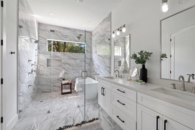 2303 Westworth Cir, Austin, TX 78704 - full bath featuring a soaking tub, a marble finish shower, double vanity, and marble finish flooring