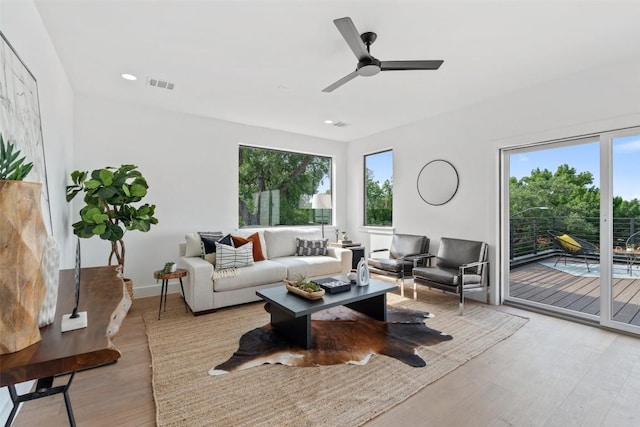 2303 Westworth Cir, Austin, TX 78704 - living room with healthy amount of natural light, light wood-type flooring, ceiling fan, baseboards, and recessed lighting