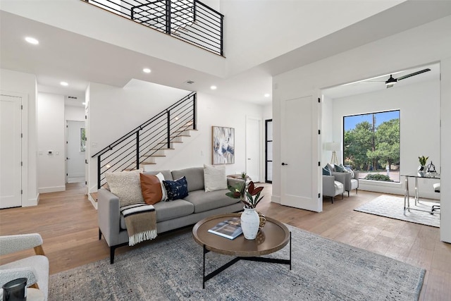 2303 Westworth Cir, Austin, TX 78704 - living area featuring light wood finished floors, stairs, recessed lighting, and baseboards