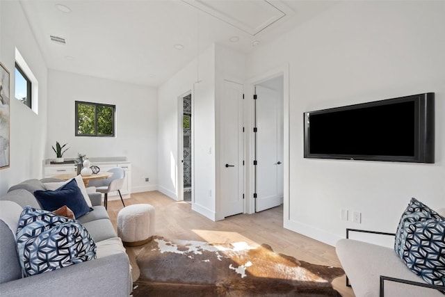 2303 Westworth Cir, Austin, TX 78704 - living area featuring attic access, light wood-style floors, and baseboards
