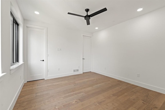 2303 Westworth Cir, Austin, TX 78704 - spare room with a ceiling fan, baseboards, light wood-style floors, and recessed lighting
