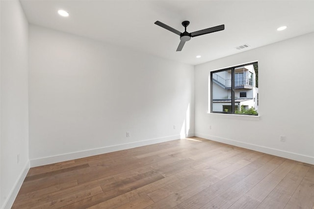 2303 Westworth Cir, Austin, TX 78704 - empty room with a ceiling fan, wood finished floors, baseboards, and recessed lighting