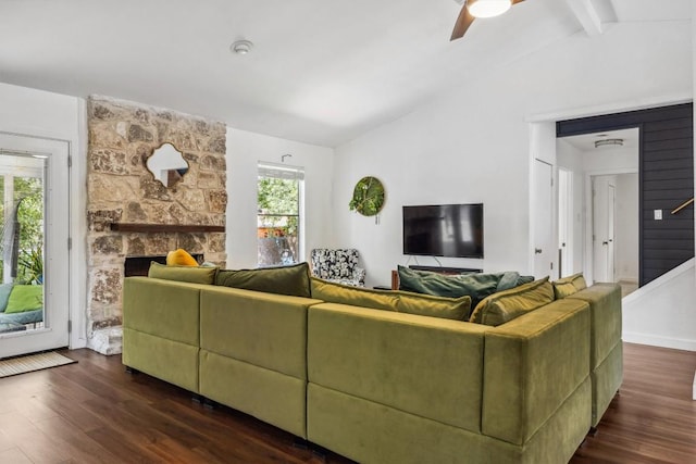 9906 Briar Ridge Dr, Austin, TX 78748 - living area with dark wood-style flooring, a stone fireplace, a ceiling fan, and stairs