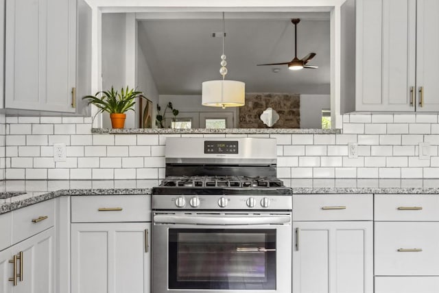 9906 Briar Ridge Dr, Austin, TX 78748 - kitchen featuring stainless steel gas stove, backsplash, a ceiling fan, and light stone countertops